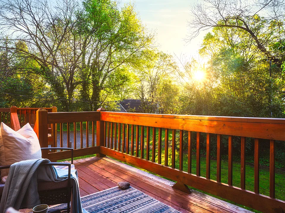 Expansive private deck overlooking a lush, tree-lined backyard_an inviting outdoor retreat for morning coffee, al fresco dining, or unwinding at the end of the day
