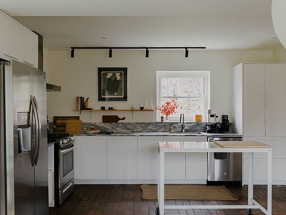Open kitchen with marble countertops