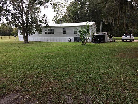 Rear w/pecan tree/sugar cane