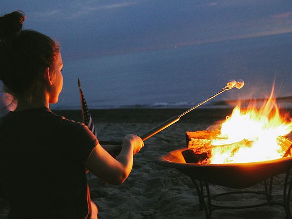Bonfires on the sandy beach.