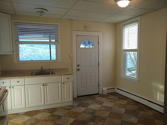 Kitchen with back door to apartment