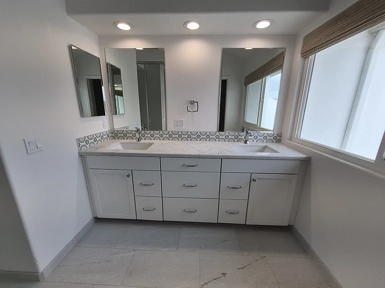 Upstairs bathroom with double vanity, natural light and amazing views with breeze.