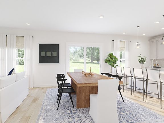 The open-concept floorplan allows for an easy flow between the kitchen and dining areas.