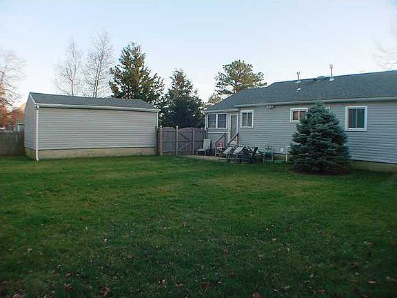 recroom off the kitchen leading to the rear yard, new flooring.