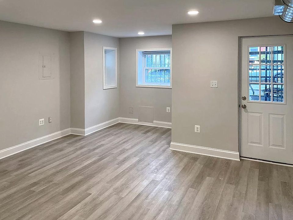 Look back at entry door, living, and desk space.