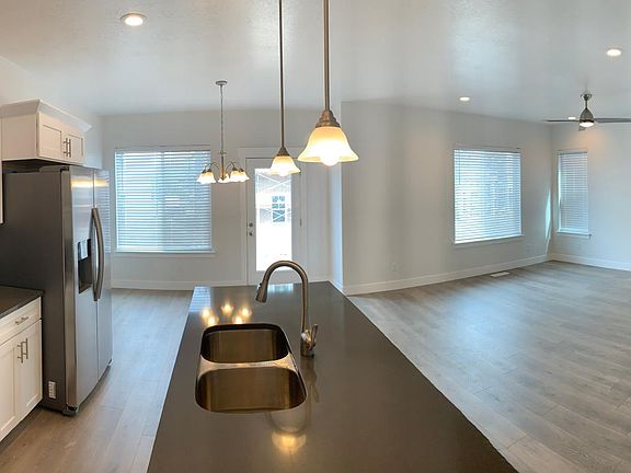 Bright open concept living area with attached patio.