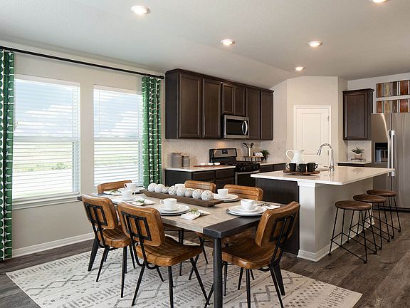 Keep everyone close with a casual dining area connected to the kitchen.