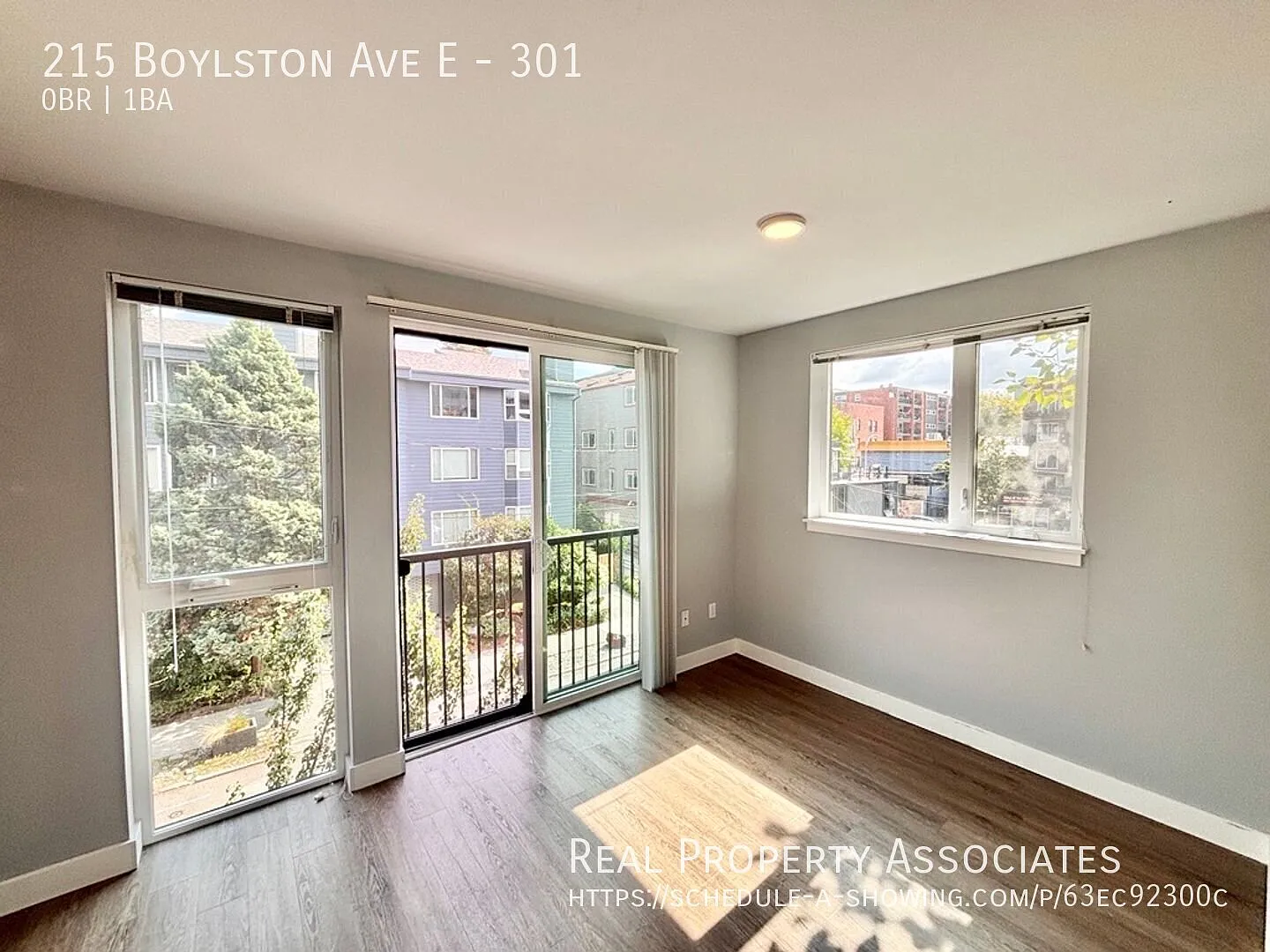 Bright & Updated Capitol Hill Studio with Juliet Balcony & In-Unit Laundry — Photo 3