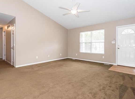 Another view of the great room and hallway leading to the bedrooms.