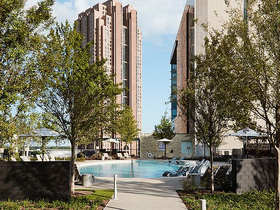 Outdoor pool and sundeck with cabanas