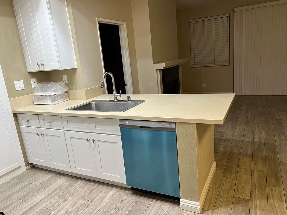 Open-concept kitchen overlooking living room.