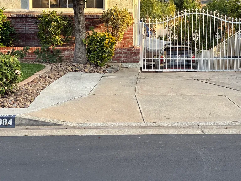 Off street parking spot on left under tree.