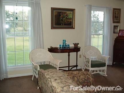 Living room
						:
						Double-paned vinyl windows throughout house