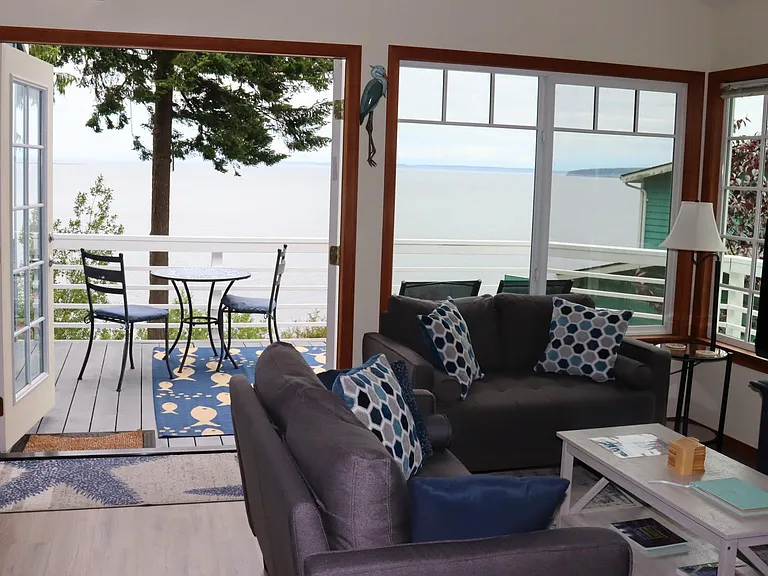 Living Room opens onto spacious deck, and looks out onto Bay