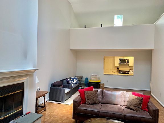 Living rm has open second story loft