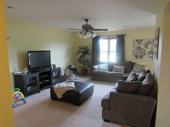 Living room area with view of pond and backyard