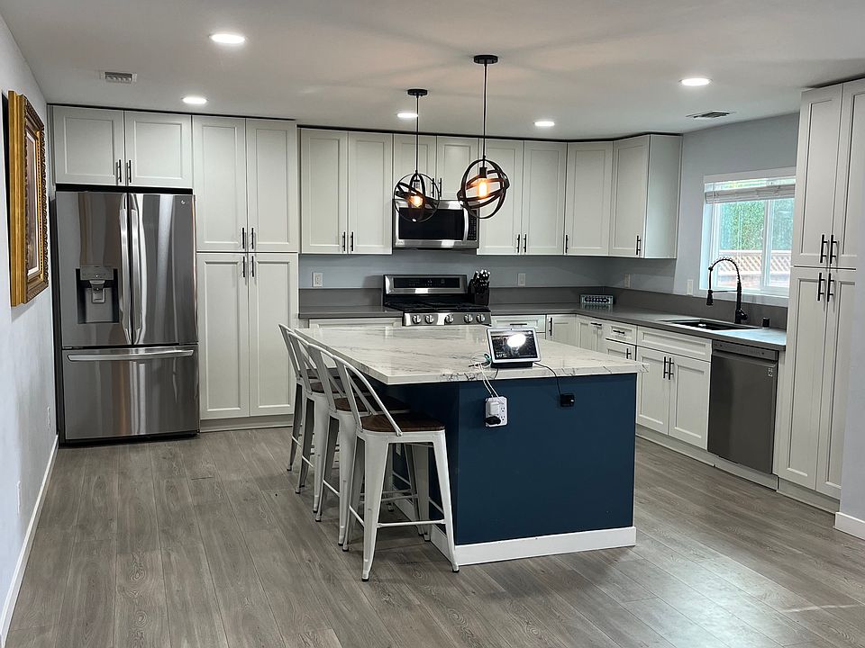Kitchen with large island. (Seats 4 and will leave bar stools).