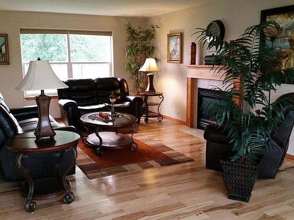Living room with real hickory wood floors and gas fireplace