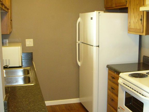 Kitchen with new stove and new refrigerator