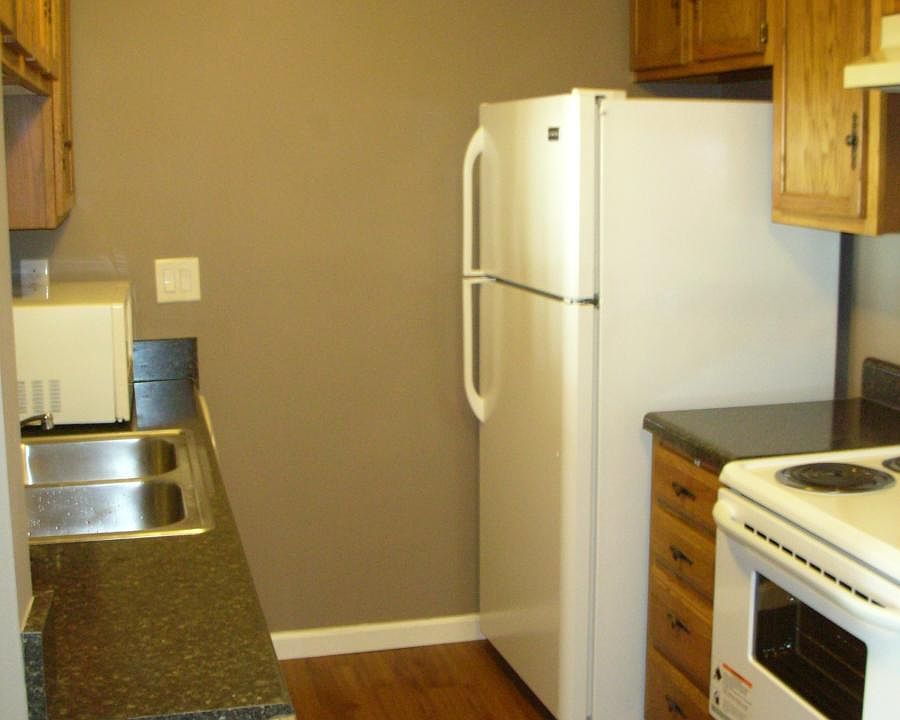 Kitchen with new stove and new refrigerator