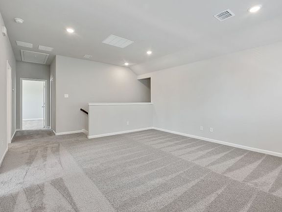 Game room in the Ryder home plan by Trophy Signature Homes - REPRESENTATIVE PHOTO
