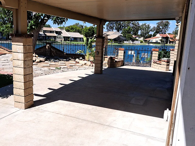 Side yard covered patio. Check out the view!
