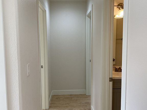 hallway toward bathroom and bedroom 1 & 2