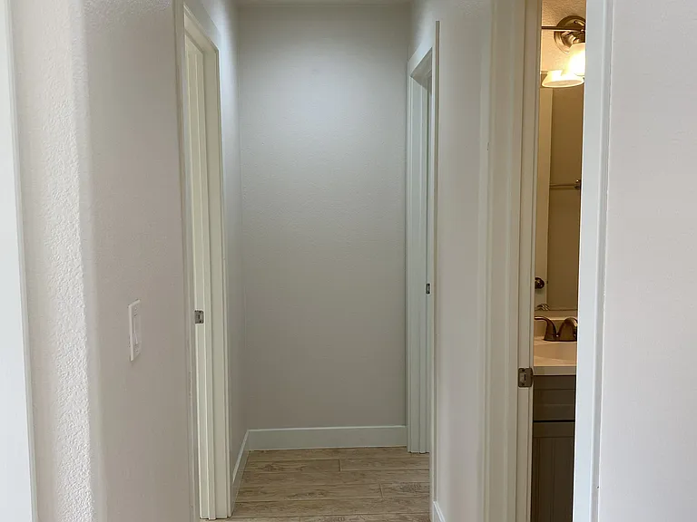 hallway toward bathroom and bedroom 1 & 2