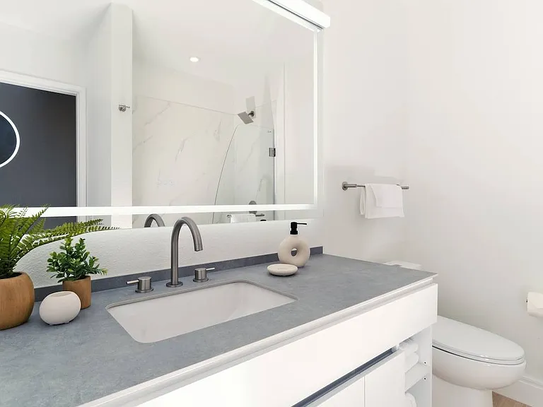 Modern bathroom with lighted mirror at Otonomus Las Vegas