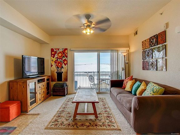 LARGE LIVING ROOM WITH ACCESS TO WEST FACING COVERED DECK