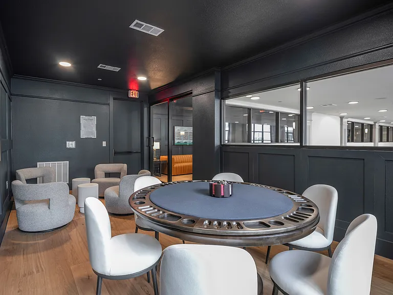 Game room with shuffleboard and billiards table