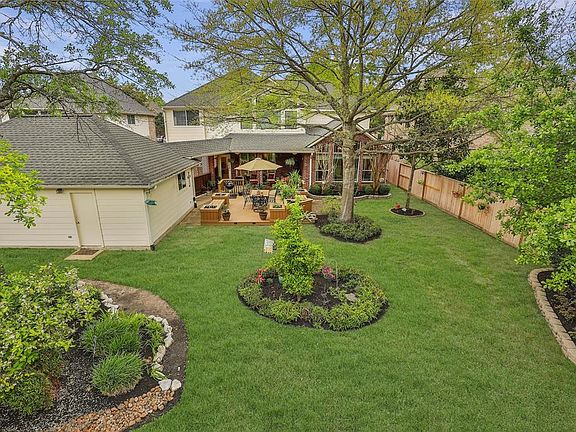 So much space in this yard, room to entertain, play, garden... you name it, the sky is the limit here! Fully irrigated including drip lines to garden area. Notice the back service door to the 3 car garage with workshop area.