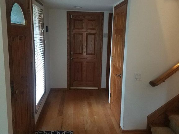 1st Floor Hallway Leading to Garage and Powder Room