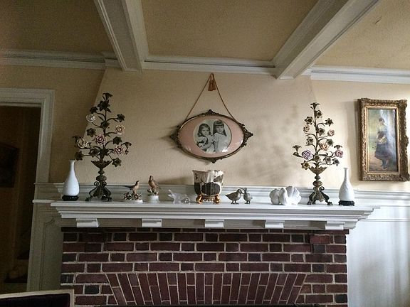 Beamed ceiling and brick fireplace