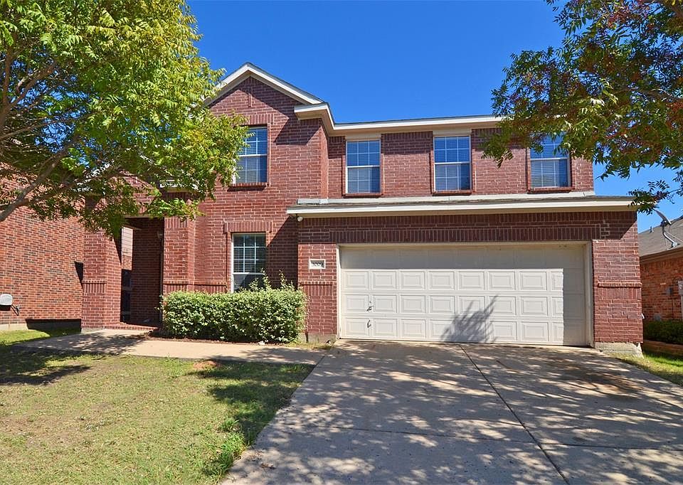 Front entrance with 2 car garage
