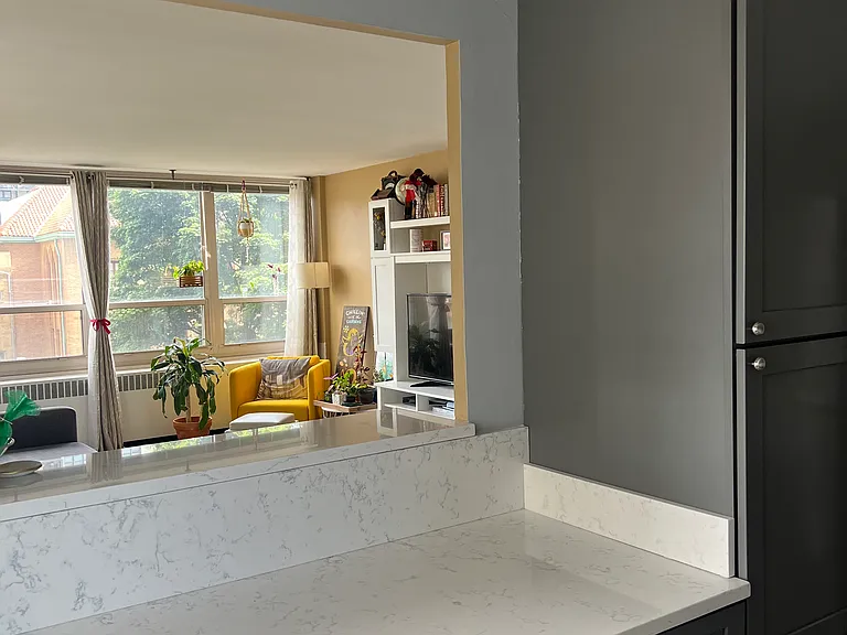 Open kitchen with lots of storage and a coffee bar for seating