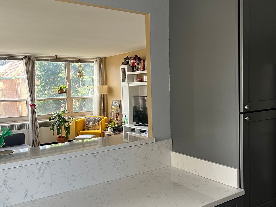 Open kitchen with lots of storage and a coffee bar for seating