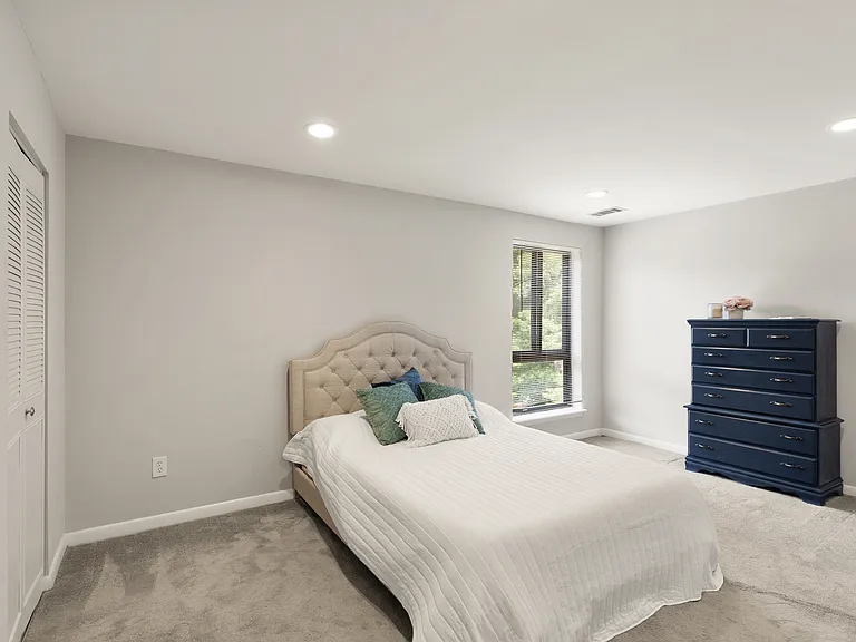 Spacious primary suite with walk-in closet and private bathroom.