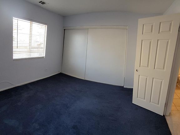East Side Bedroom Downstairs with Downstairs Bath (Curved Due to Panoramic Shot)