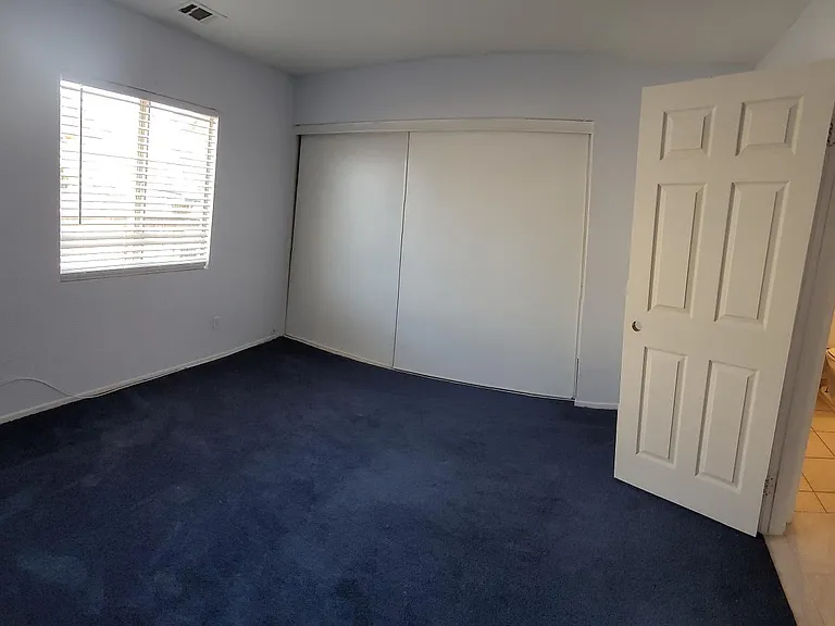 East Side Bedroom Downstairs with Downstairs Bath (Curved Due to Panoramic Shot)