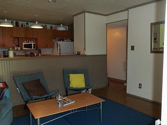 VIEW OF DEN LEADING TO THE BEDROOMS