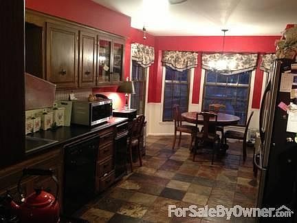 Kitchen
						:
						Updated, stainless appliances, African Blaze slate flooring