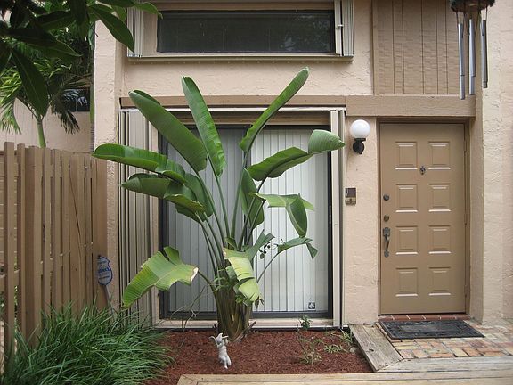 Entrance. Accordion shutters up & downstairs