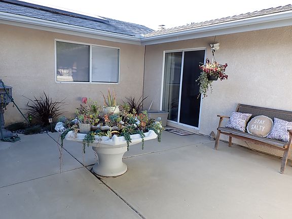 Enclosed patio with succulent fountain