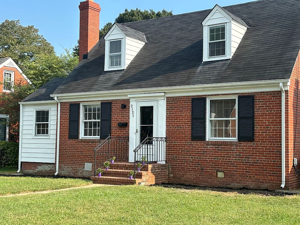 2121 New Berne cute Cape Cod. Street newly paved, and 2 parking spots out front.