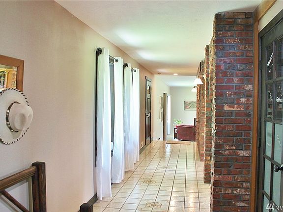 Freshly painted, plenty of natural light bring this home to life.  Take your time as you stroll thru this home.  Lots of brick detail in the kitchen to the tiles on the floor. This home has just what you are looking for.