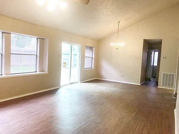 Great room has plenty of room for a full-sized dining table for entertaining with easy access to the kitchen with updated black 