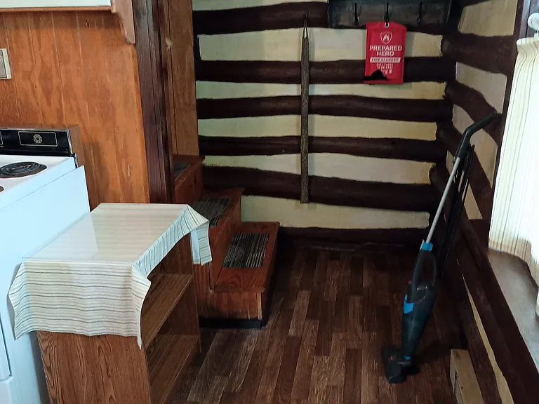 Looking from front door to bottom of stairs, in kitchen.