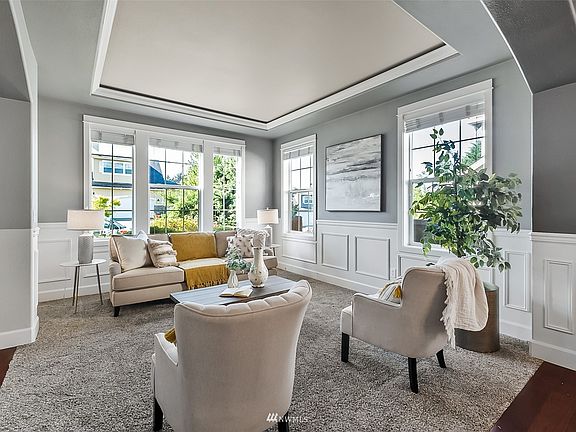 The elegant, yet comfortable, formal living room is luminous and spacious. >