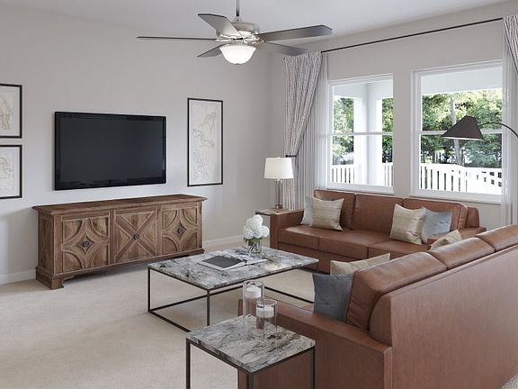 The spacious family room is the perfect space to entertain, offering proximity to the dining area as